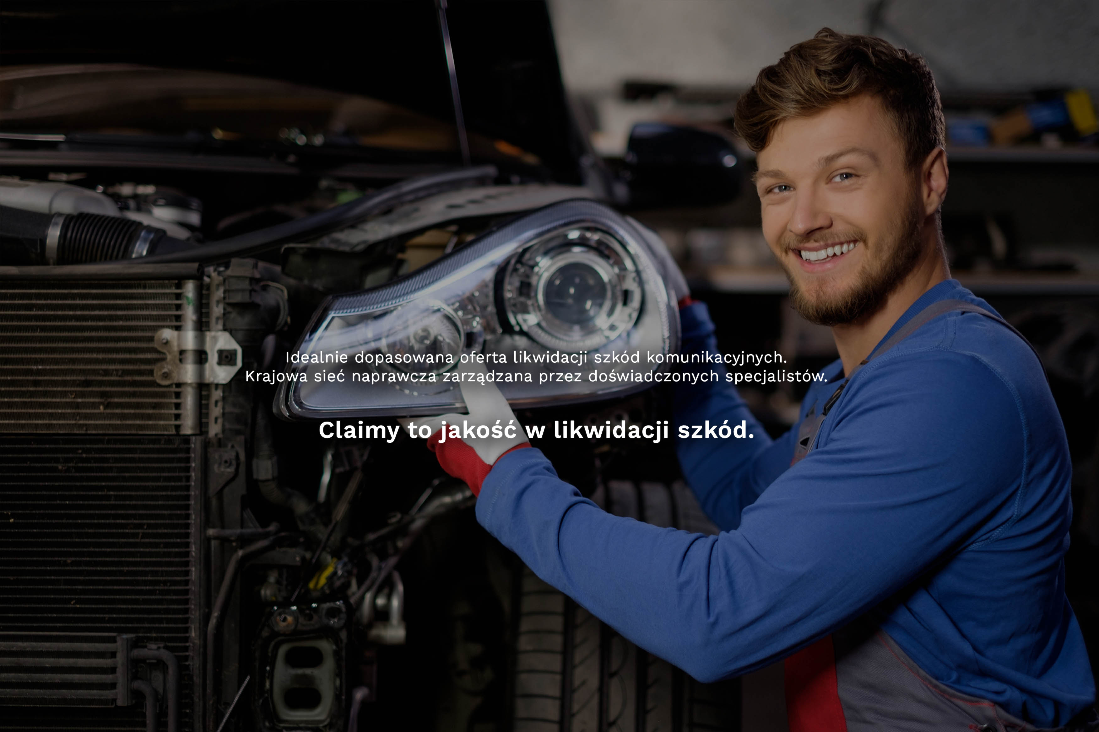 View of a Young attractive mechanic working at the garage