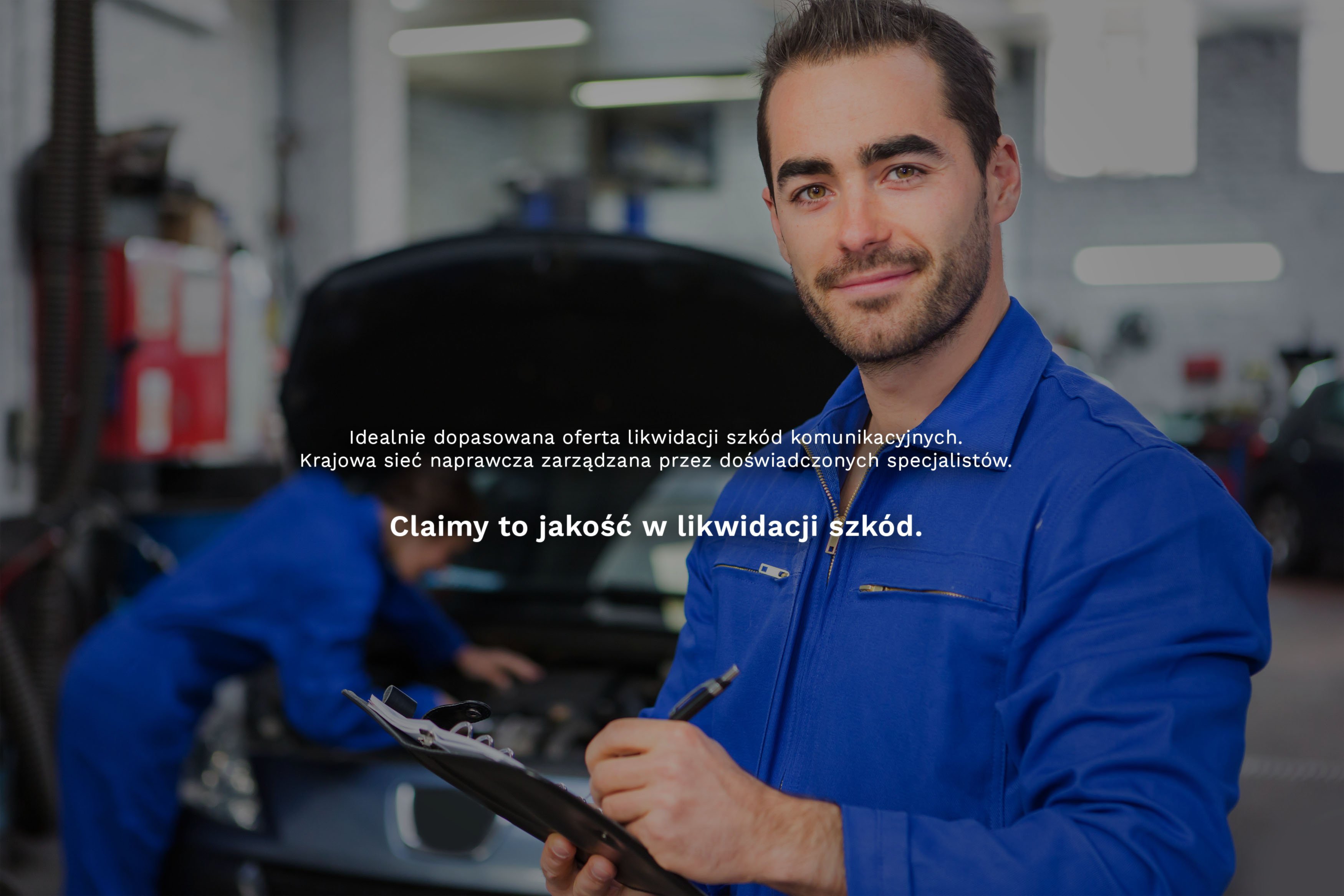 View of a Young attractive mechanic working at the garage